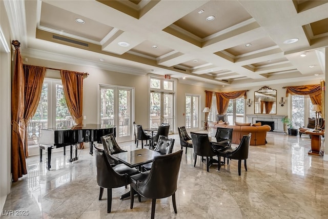 dining room with french doors, coffered ceiling, plenty of natural light, and a fireplace