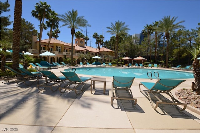 community pool with a patio