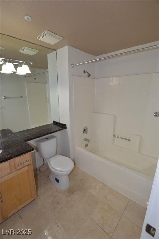 bathroom with  shower combination, vanity, toilet, and tile patterned floors