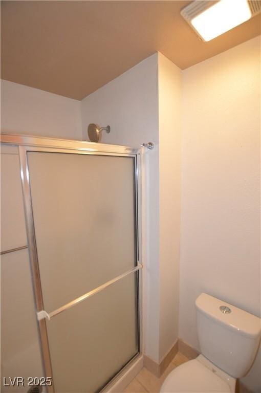 full bathroom with toilet and a shower stall