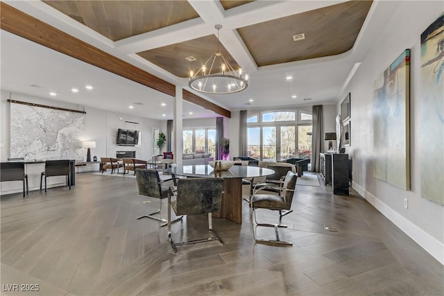 dining room with beamed ceiling, wood ceiling, a notable chandelier, and coffered ceiling