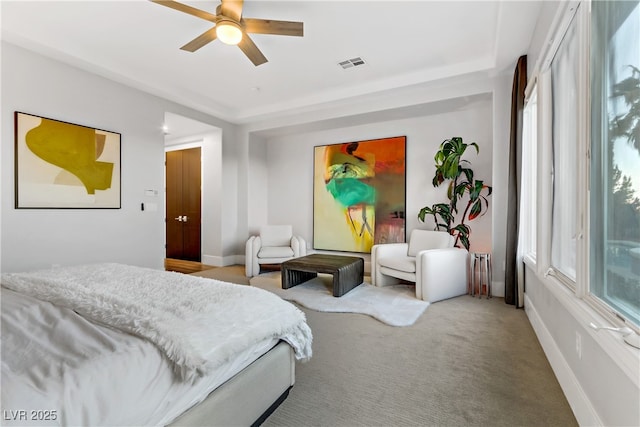 bedroom featuring ceiling fan, radiator heating unit, and carpet floors