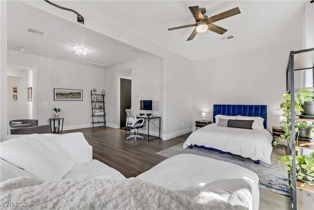 bedroom with ceiling fan and dark hardwood / wood-style flooring