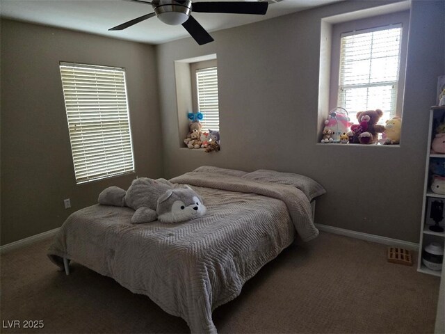 bedroom featuring ceiling fan and carpet