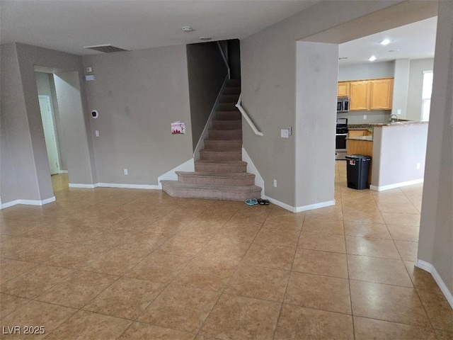 interior space with tile patterned floors