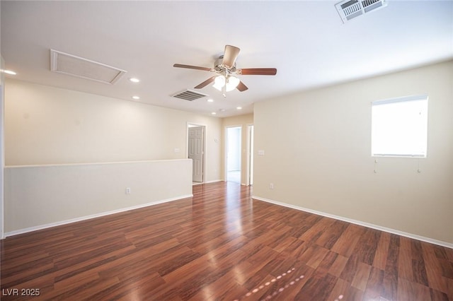 empty room with ceiling fan and dark hardwood / wood-style floors