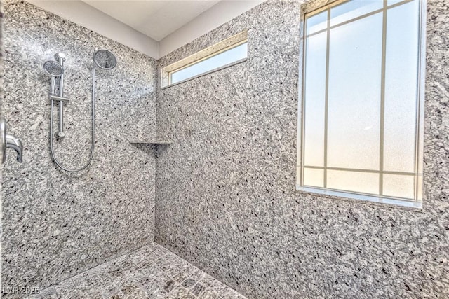 bathroom featuring tiled shower