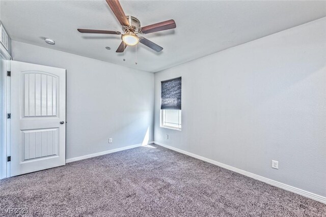 empty room featuring carpet floors and ceiling fan