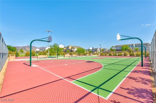 view of sport court with a mountain view