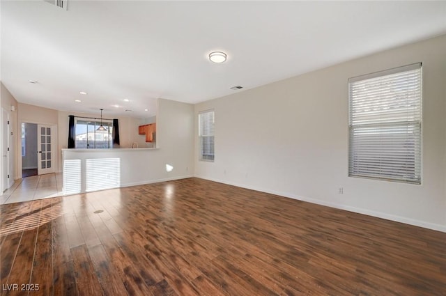 unfurnished living room with hardwood / wood-style floors