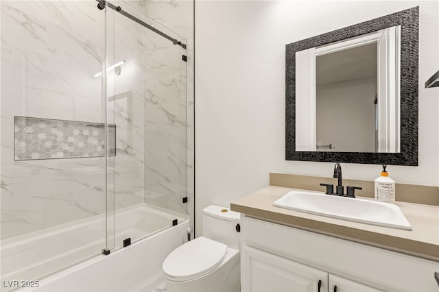 full bathroom featuring vanity, bath / shower combo with glass door, and toilet