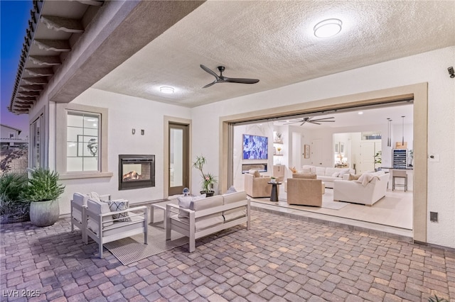 view of patio / terrace featuring ceiling fan and an outdoor hangout area