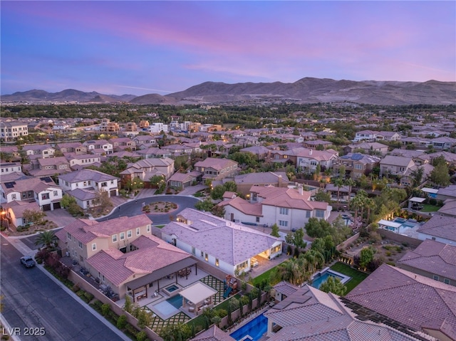 aerial view at dusk with a mountain view