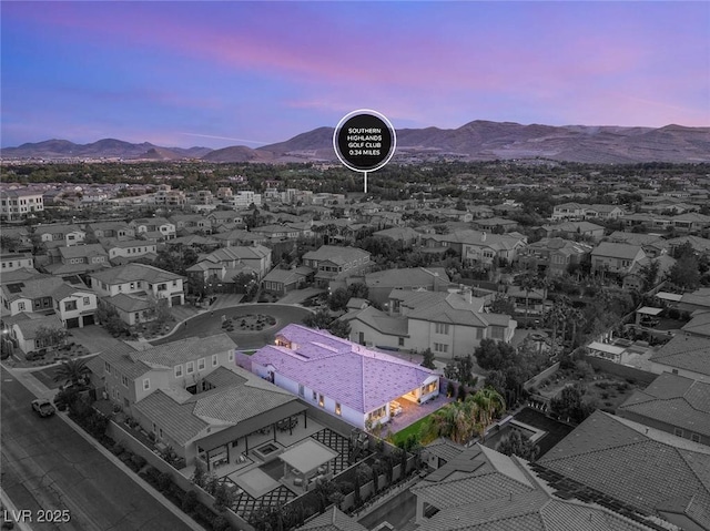 aerial view at dusk with a mountain view