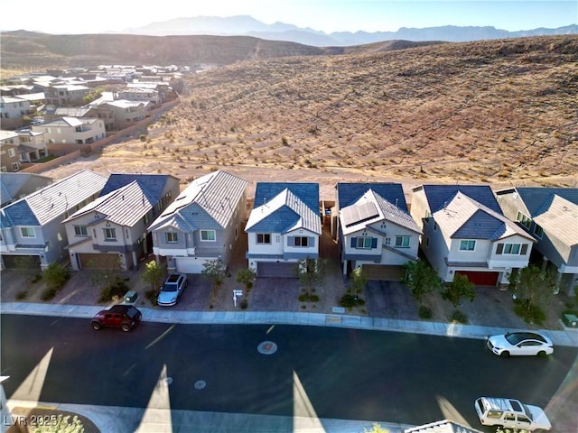 birds eye view of property featuring a mountain view