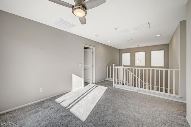 unfurnished room featuring carpet flooring and ceiling fan