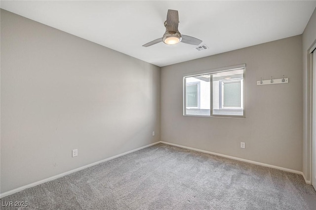 unfurnished room with carpet floors and ceiling fan