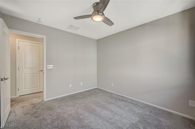 unfurnished room featuring light carpet and ceiling fan