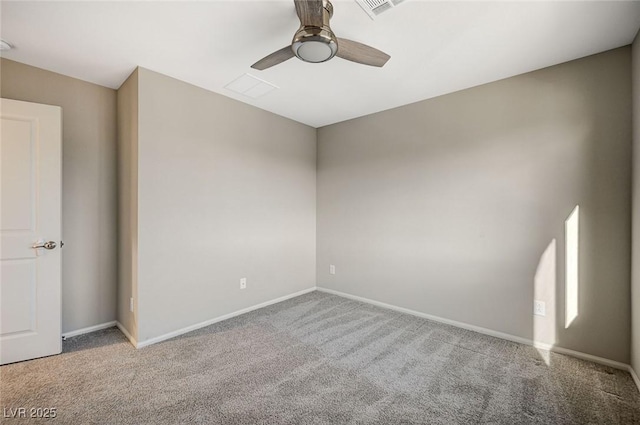 empty room featuring light colored carpet and ceiling fan