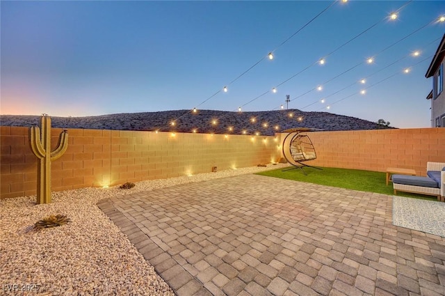 view of patio terrace at dusk