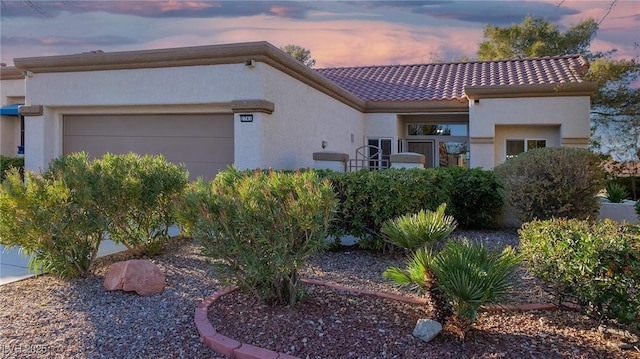 view of front of property featuring a garage