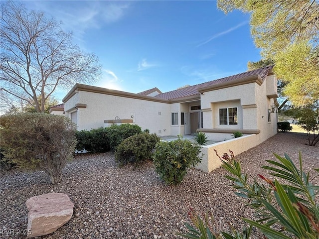 rear view of house with a patio area