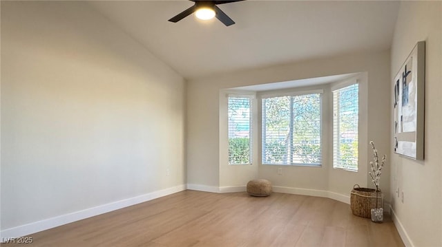 unfurnished room featuring vaulted ceiling, light hardwood / wood-style flooring, and ceiling fan