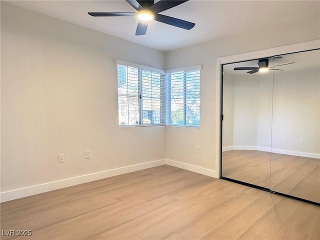 unfurnished bedroom with a closet, light hardwood / wood-style floors, and ceiling fan