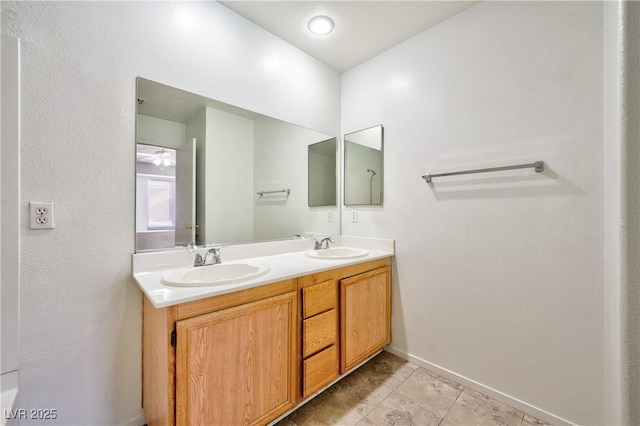 bathroom featuring tile patterned floors and vanity