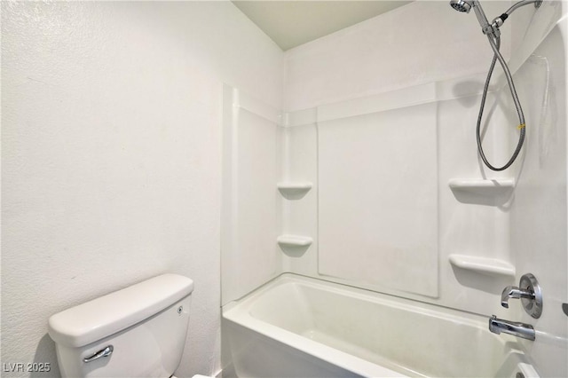 bathroom with toilet and washtub / shower combination