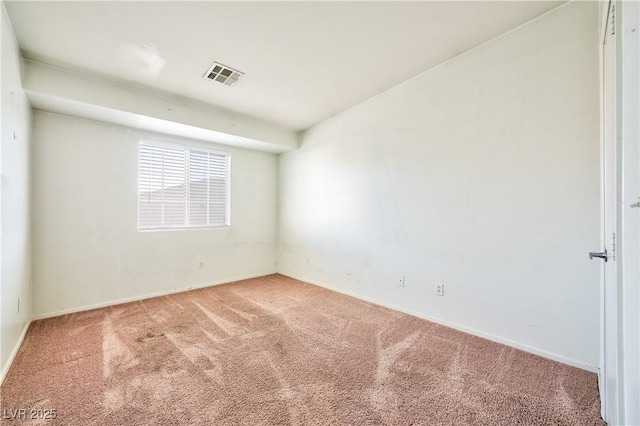 spare room featuring carpet floors