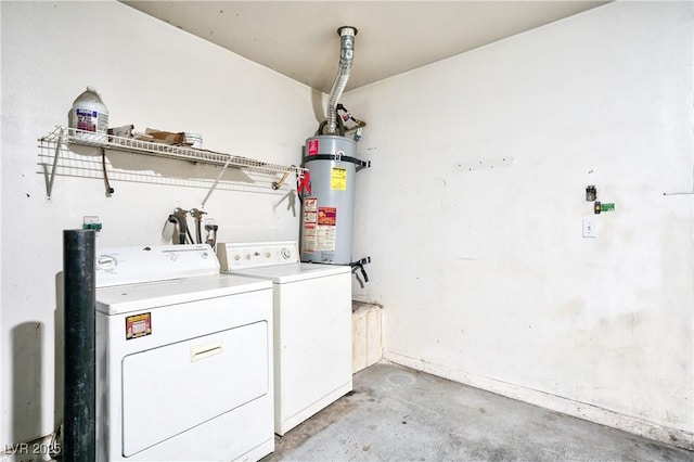 washroom featuring secured water heater and washer and clothes dryer