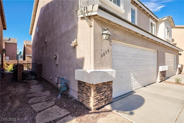 view of property exterior with a garage