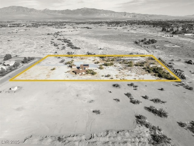 birds eye view of property featuring a mountain view