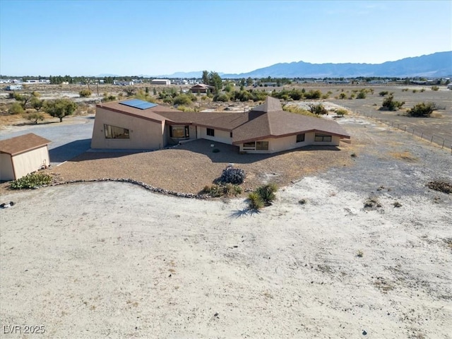 exterior space featuring a mountain view