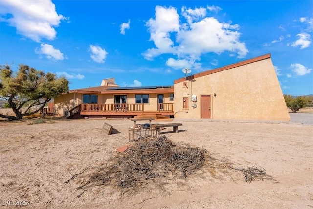 rear view of property with a deck