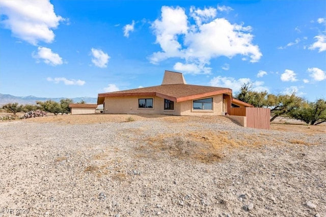 rear view of house with a mountain view