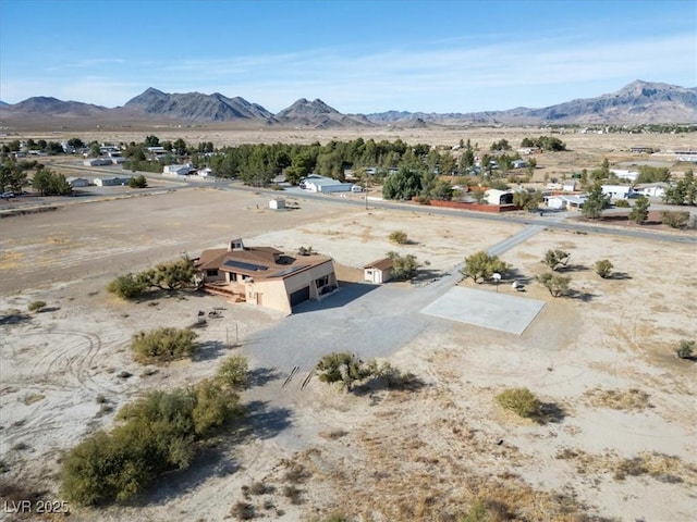 birds eye view of property with a mountain view