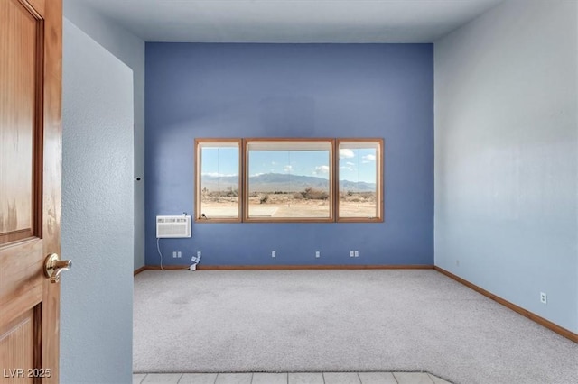 carpeted spare room featuring a wall mounted air conditioner