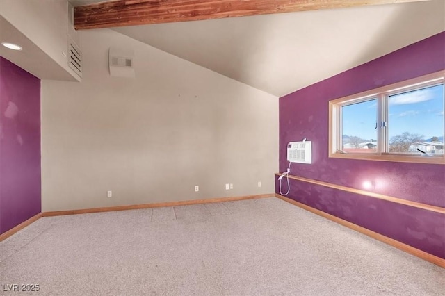 unfurnished room featuring a wall mounted AC, carpet floors, and lofted ceiling with beams