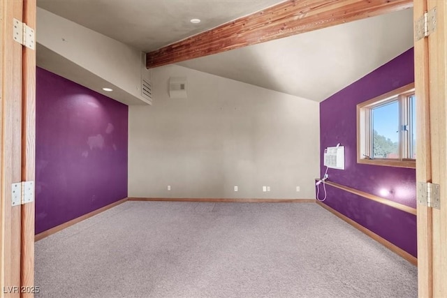 carpeted spare room with vaulted ceiling with beams