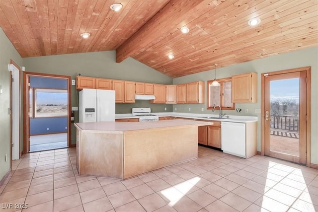 kitchen featuring decorative light fixtures, a kitchen island, white appliances, and light brown cabinets