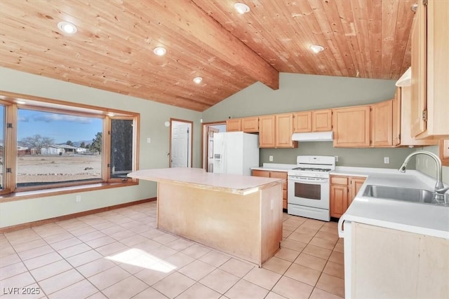 kitchen featuring sink, beamed ceiling, white appliances, light brown cabinetry, and a kitchen island