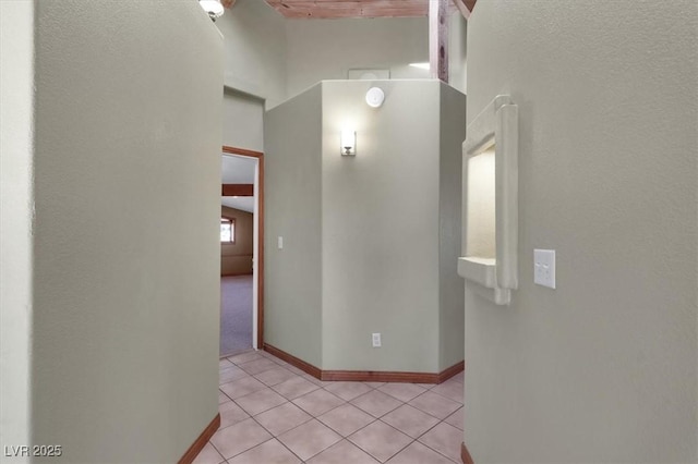 hallway featuring light tile patterned floors