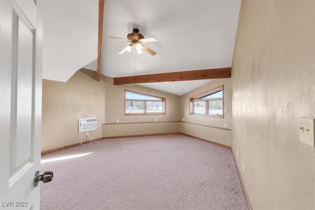 carpeted spare room featuring a wall mounted AC, vaulted ceiling with beams, and ceiling fan