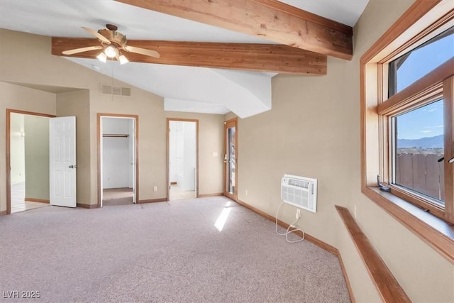 unfurnished bedroom with ceiling fan, lofted ceiling with beams, carpet floors, and a wall unit AC