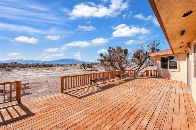 wooden terrace featuring a mountain view