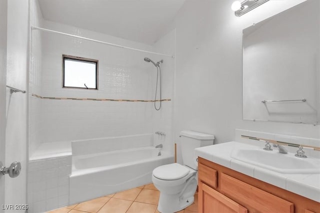 full bathroom with tile patterned floors, vanity, bathtub / shower combination, and toilet