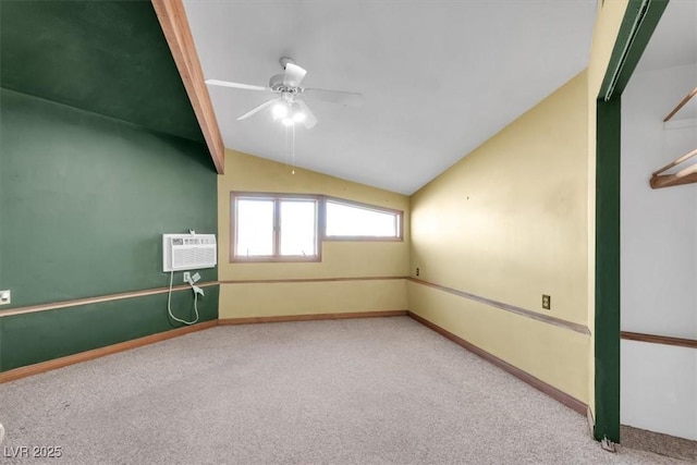 unfurnished room featuring carpet, ceiling fan, an AC wall unit, and vaulted ceiling