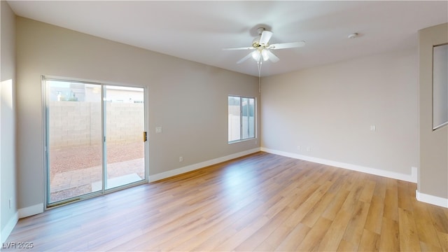 empty room featuring ceiling fan and light wood-type flooring